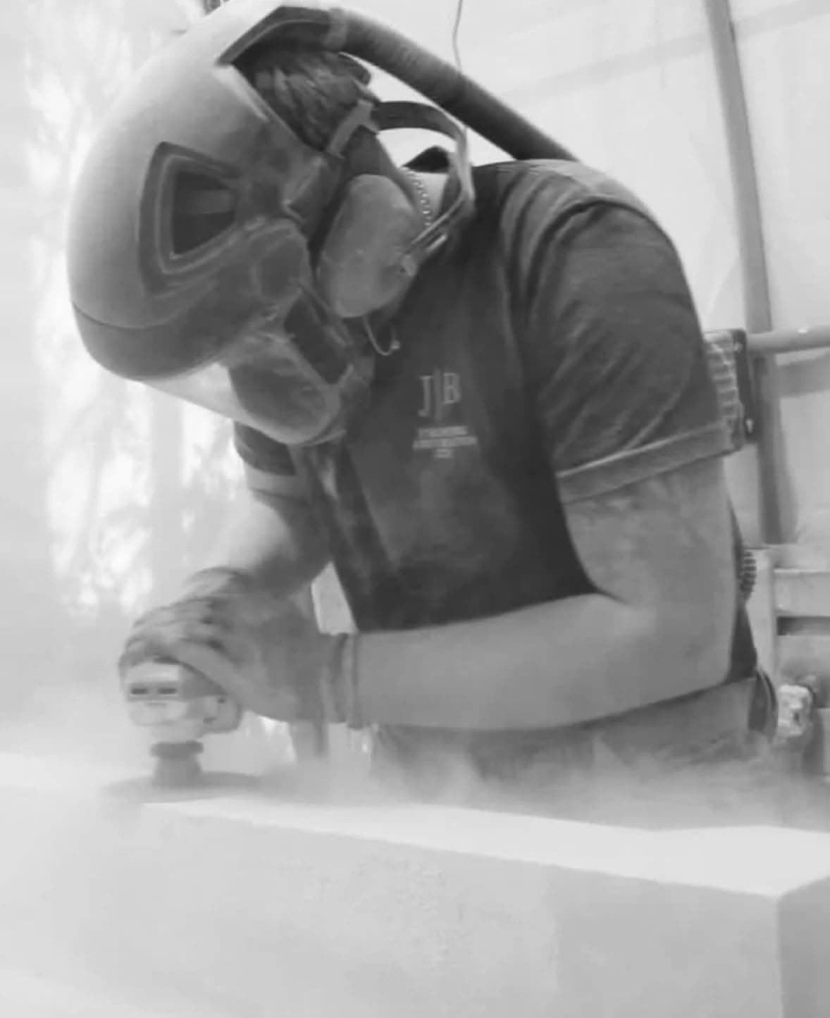 Skilled stonemason polishing natural stone